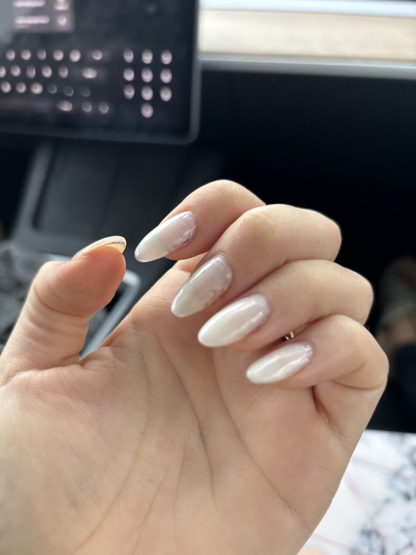 Manicure setup with bottles and lamps
